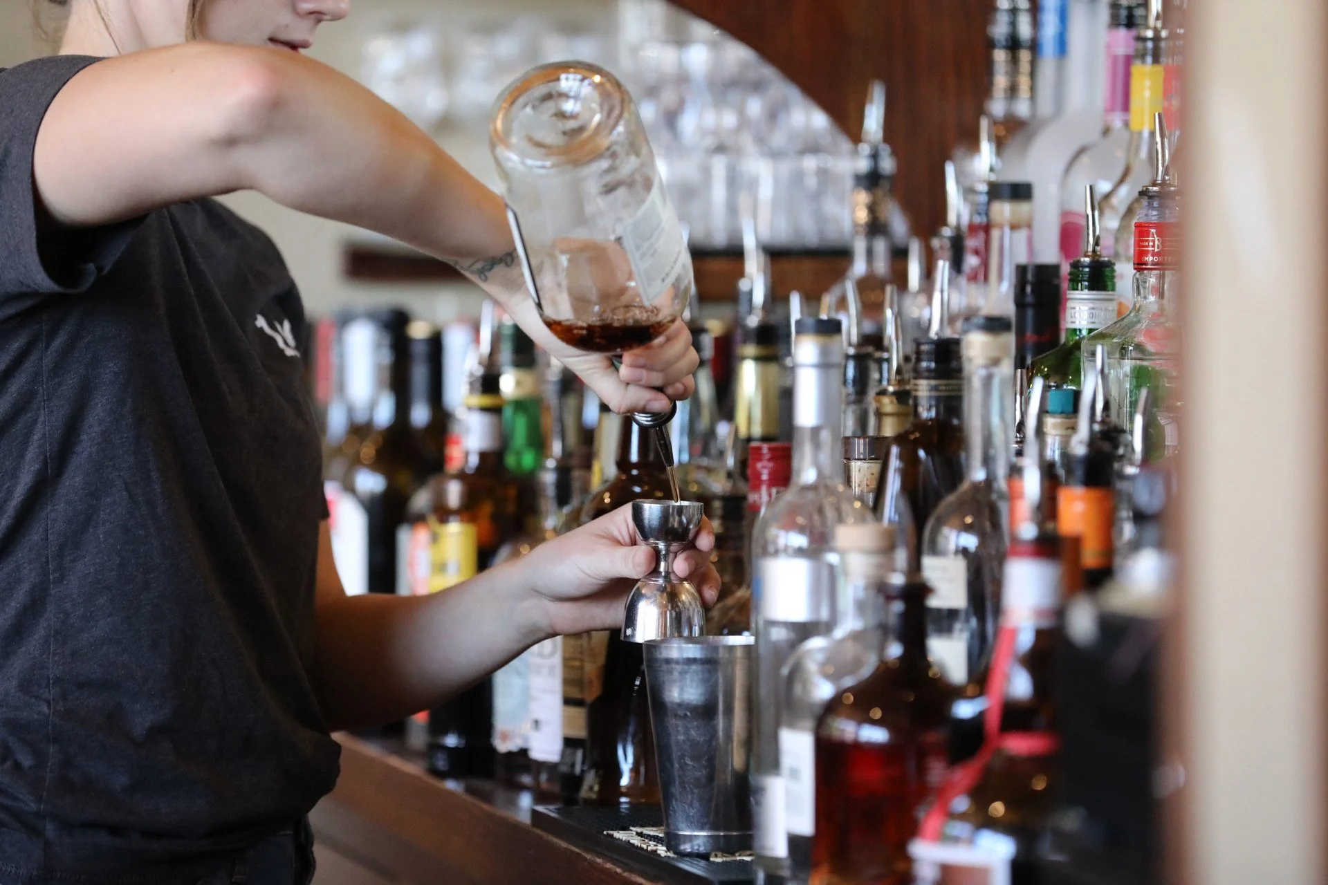 A bartender making a cocktail at Cleveland-Heath